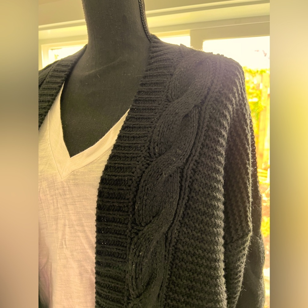 Black cardigan sweater.